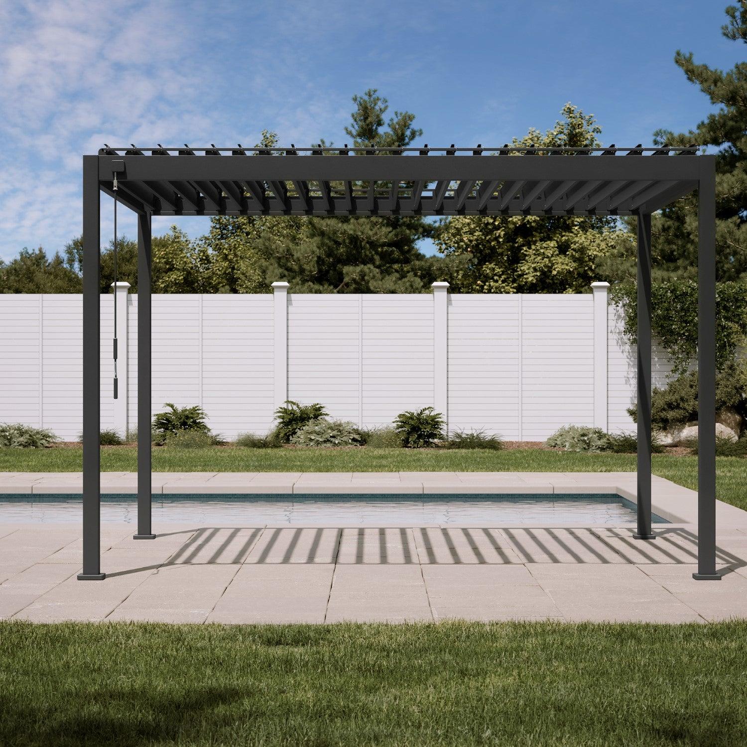 Mirador 88S pergola in charcoal seen head-on with the louvers open, casting striped shade on a poolside terrace