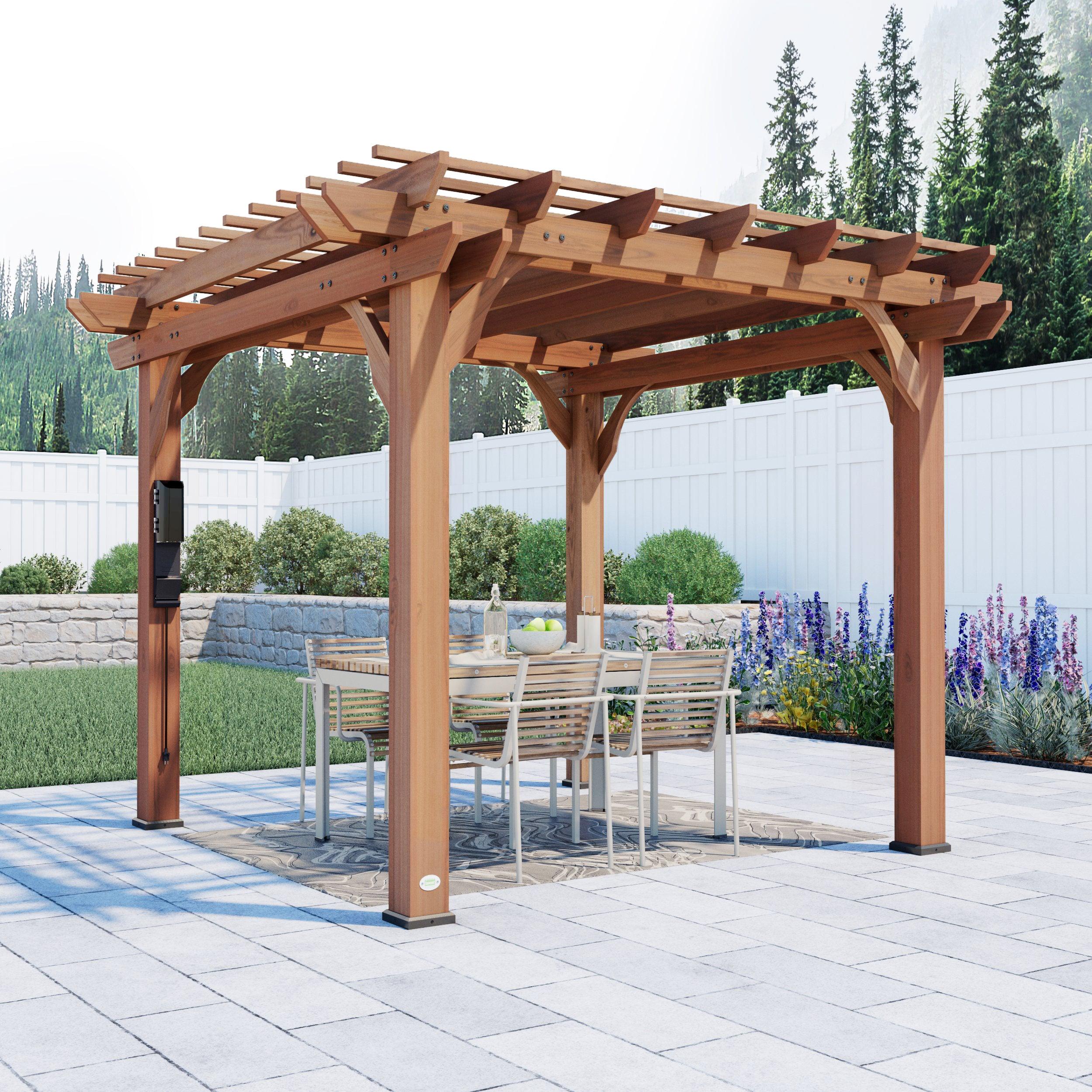 Backyard Discovery Beaumont cedar pergola kit over a patio dining table, multi-level trellis roof