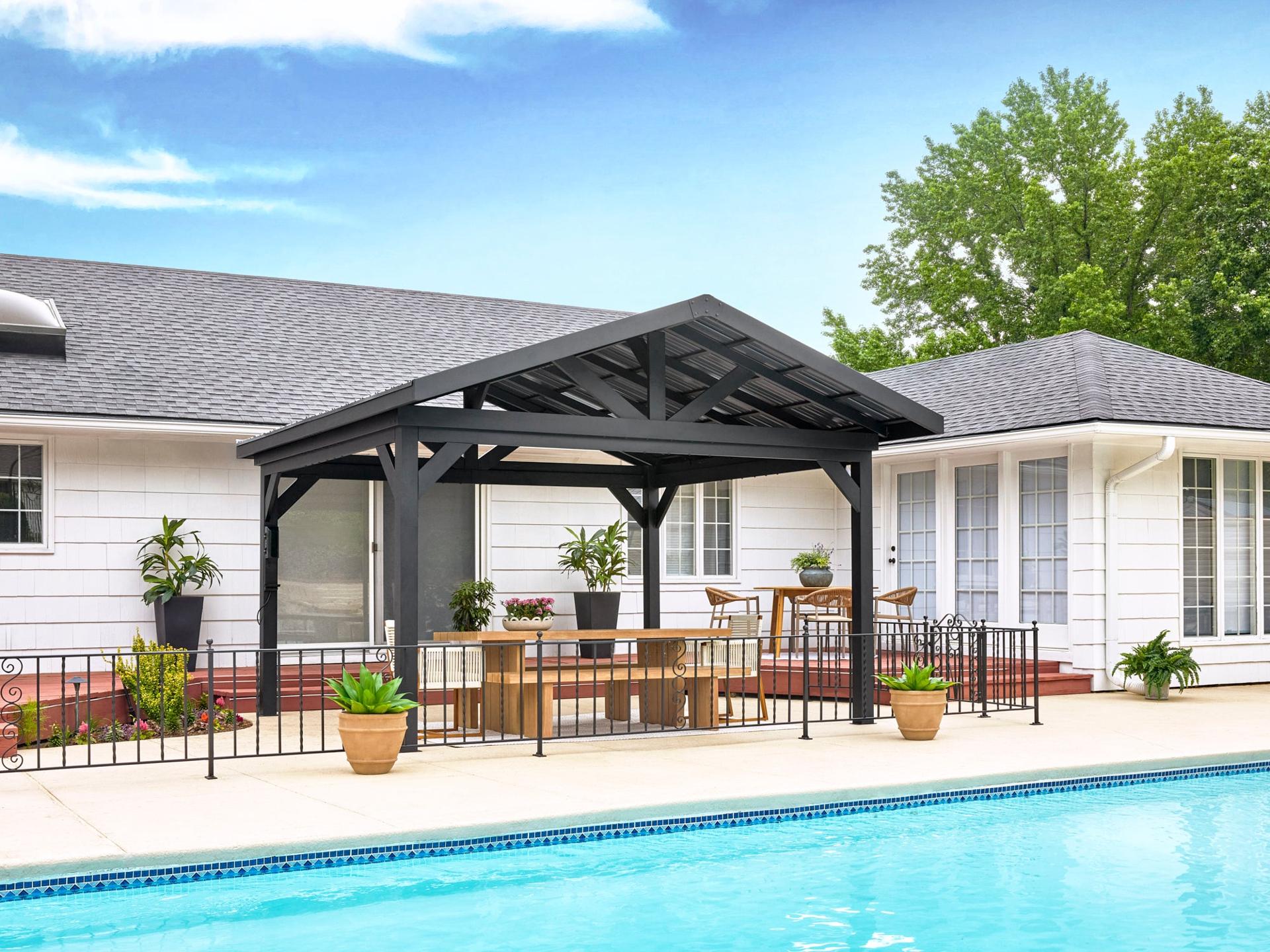 Backyard Discovery Lancaster black steel gazebo with a gable roof beside a pool, set with a picnic table