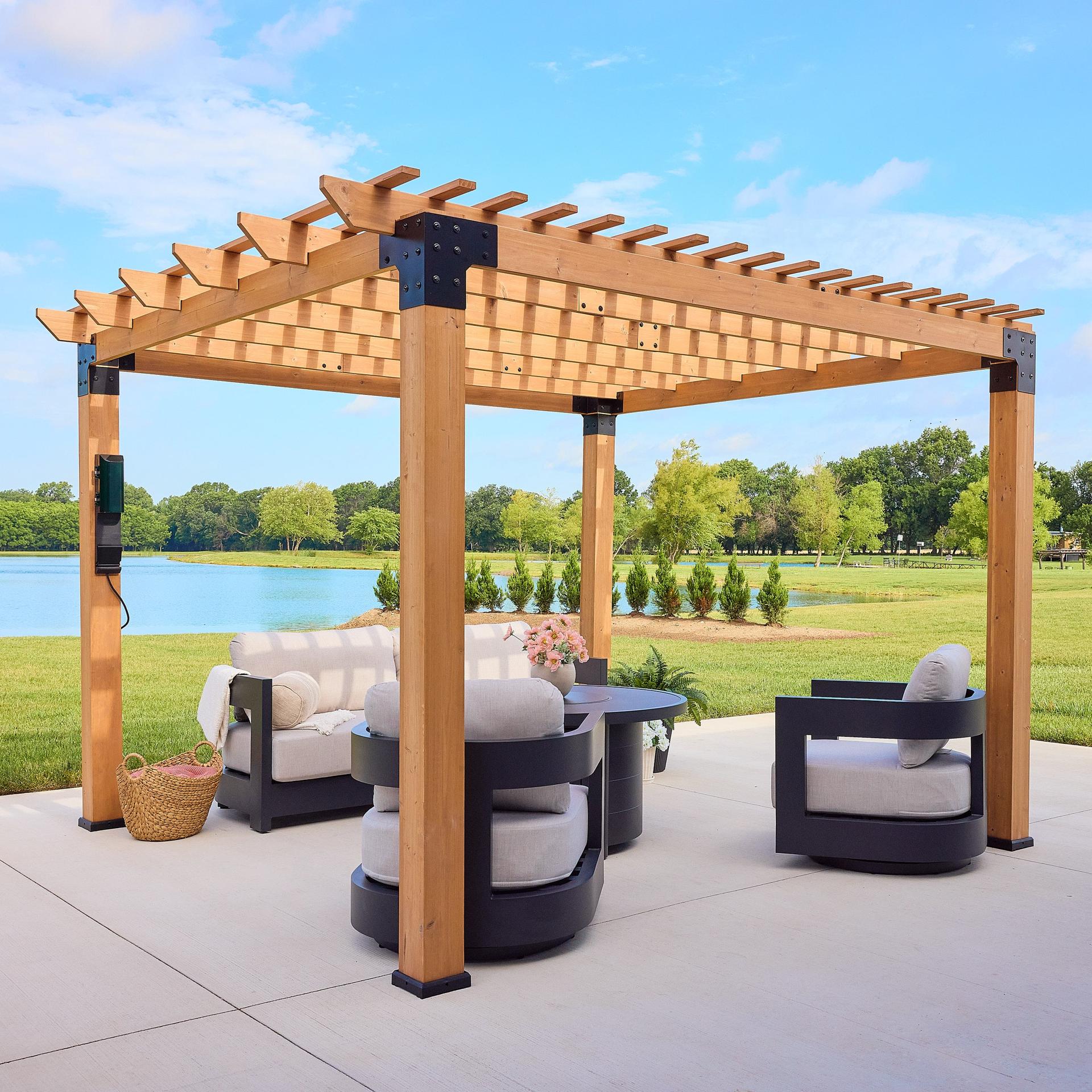 Backyard Discovery Montrose cedar pergola with a layered purlin roof over lounge chairs beside a lake
