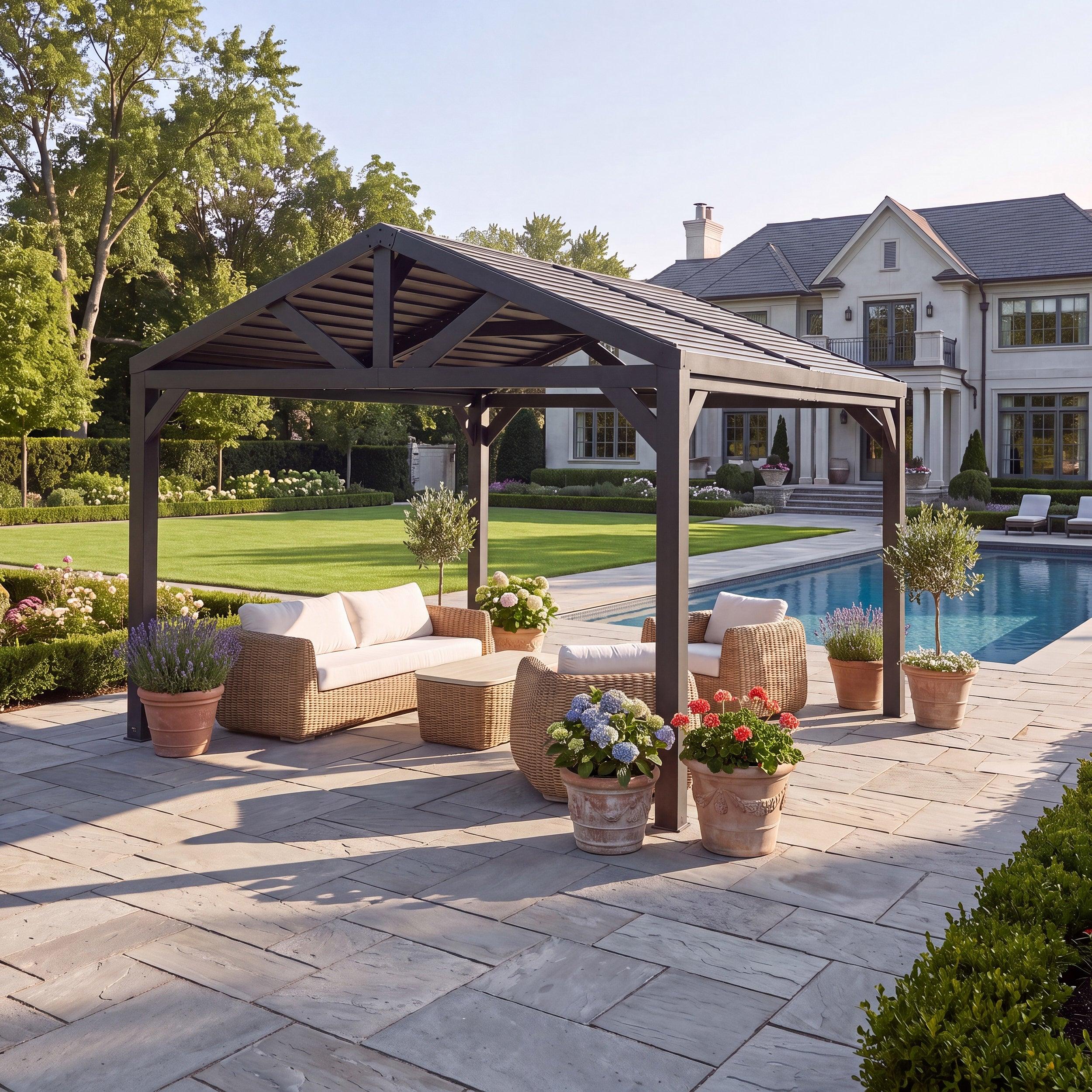 Backyard Discovery Ridgeline steel louvered pergola in matte black, gabled roof, over a poolside patio seating set