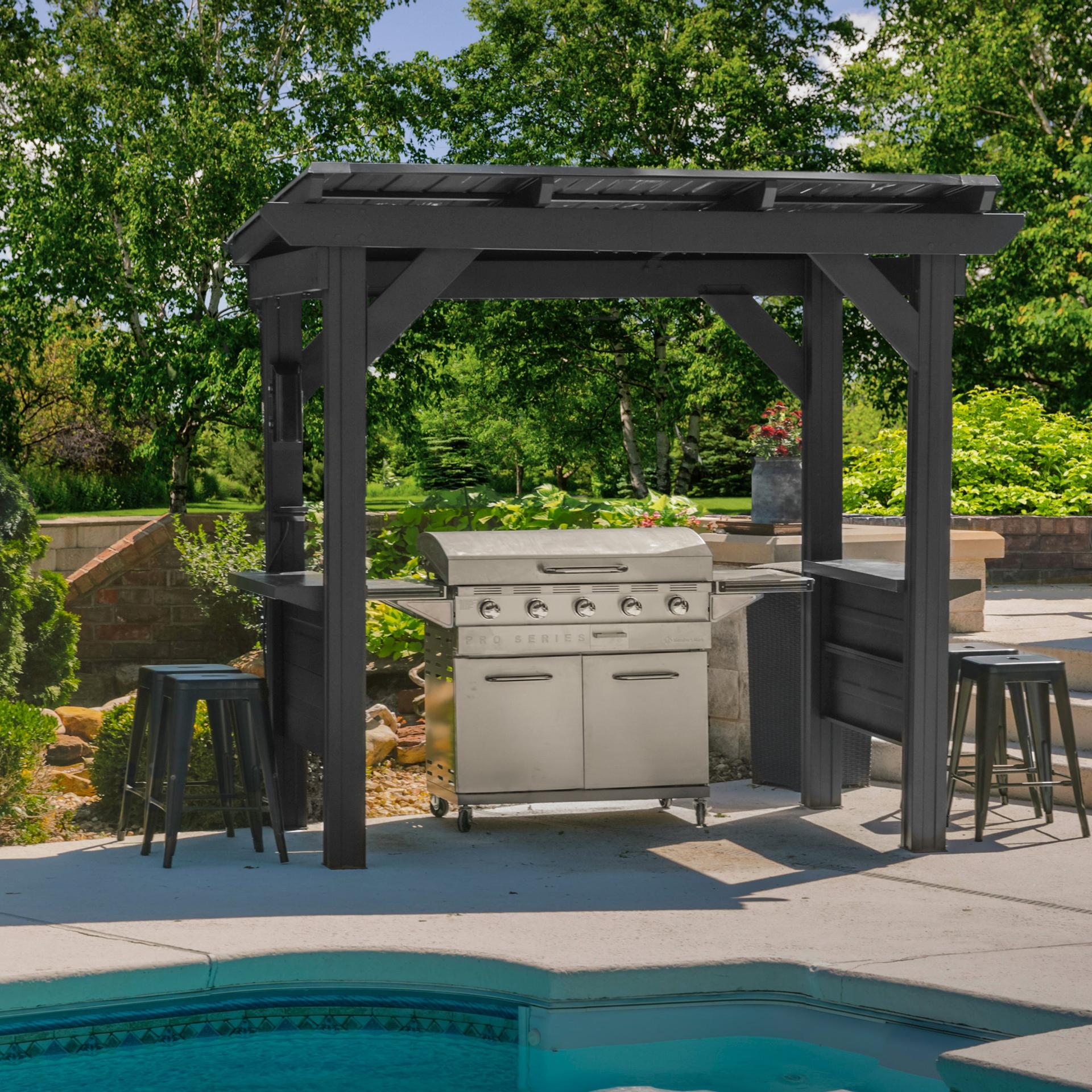 Backyard Discovery Rockport black steel grill gazebo with bar counters beside a pool