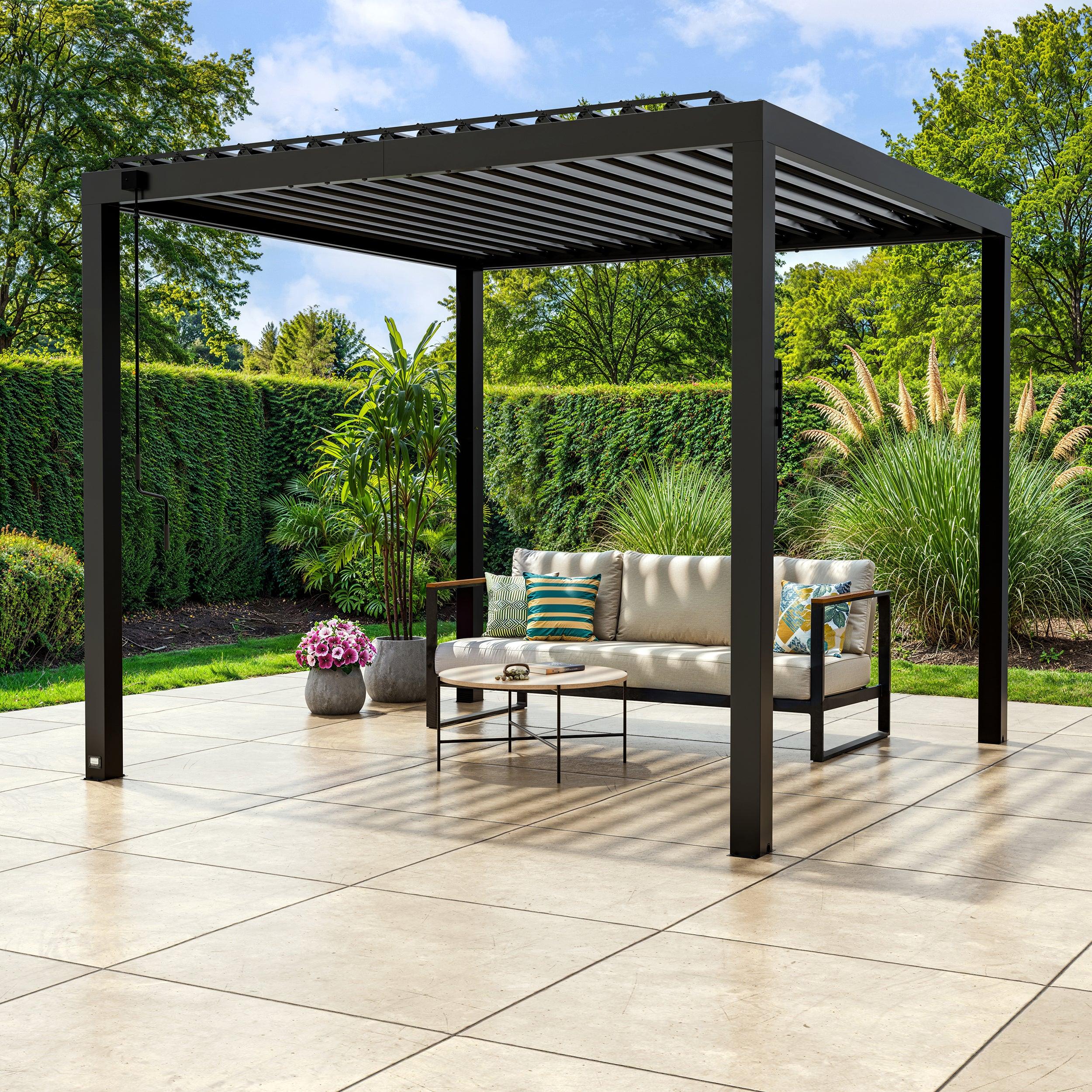 Backyard Discovery Sarasota steel louvered pergola in black over a patio sofa, louvers partly open
