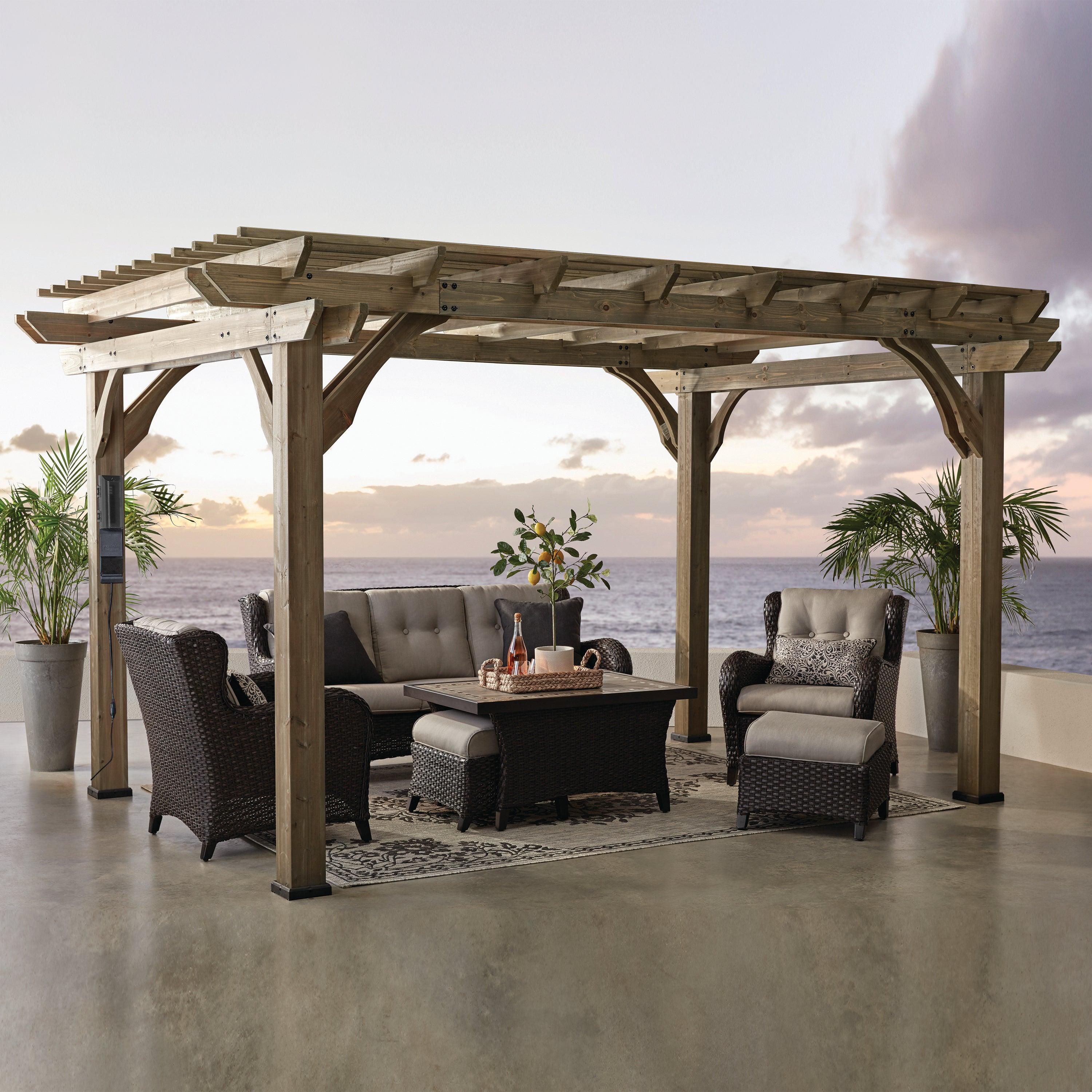 Backyard Discovery Somerville cedar pergola in barnwood stain over a seaside terrace seating set