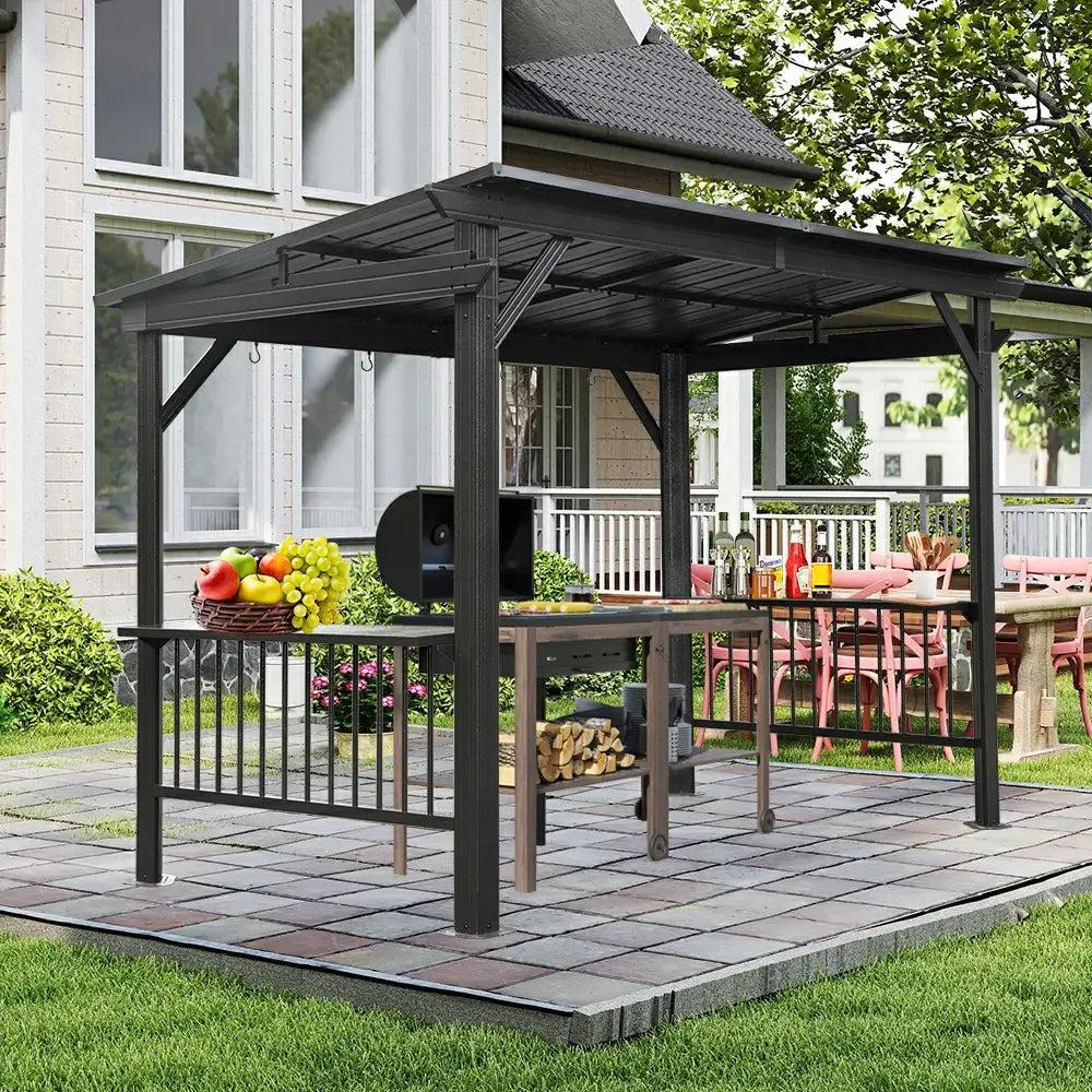 Domi Outdoor Living 6.5x12 hardtop grill gazebo with a sloping roof over a grill and a bar counter on a paved patio