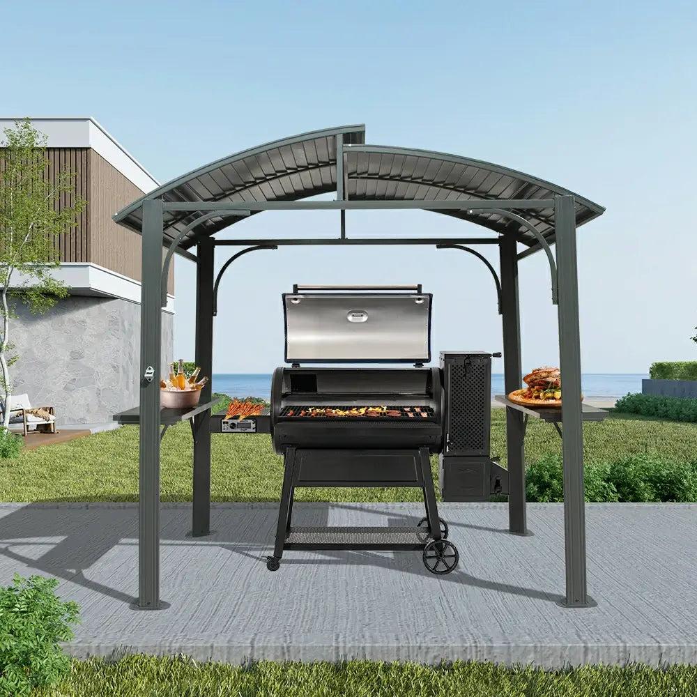 Domi Outdoor Living 8x5 outdoor grill gazebo with an arched roof over a pellet grill on a stone patio