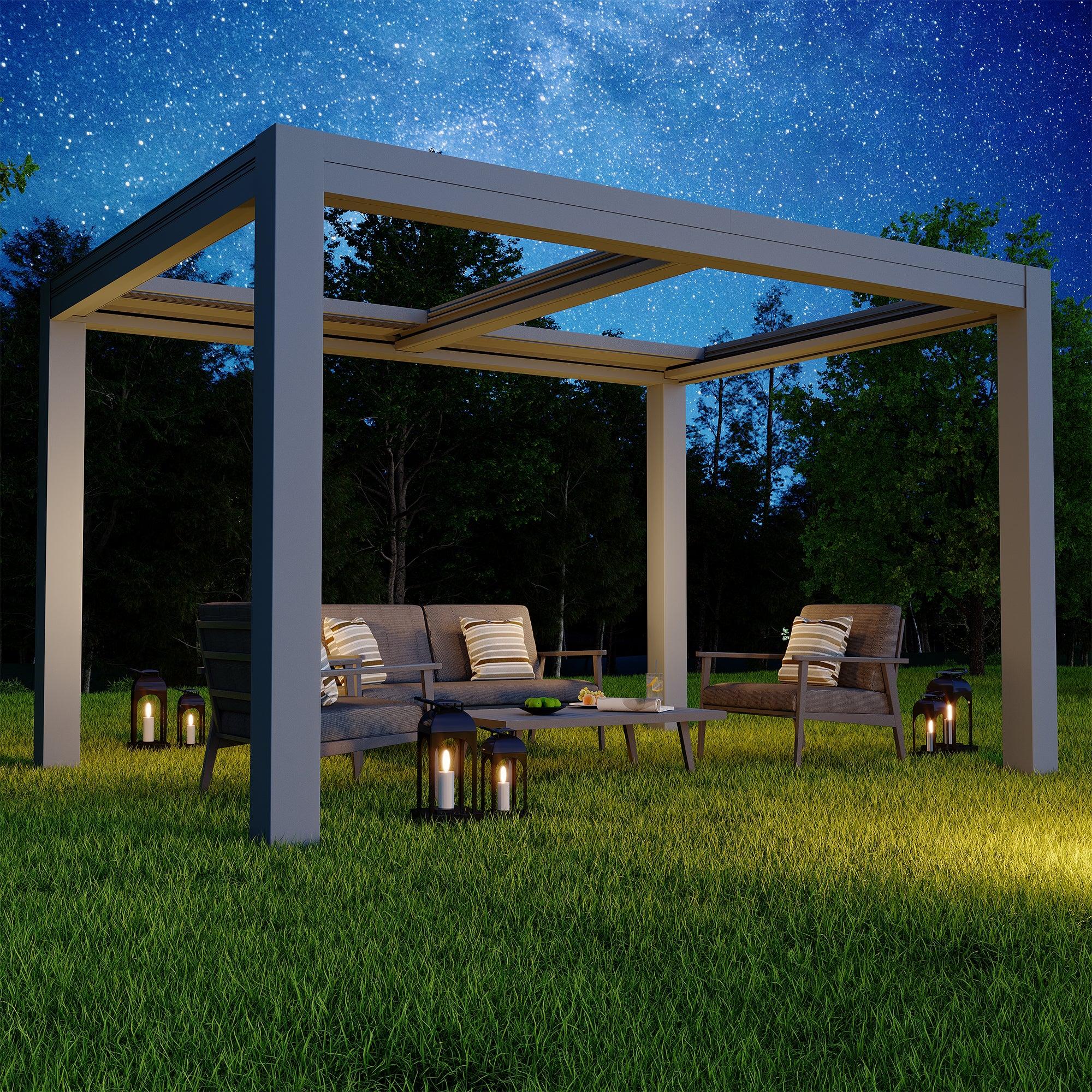 EROMMY smart electric pergola in dark grey with movable louvers, lit at dusk over a lawn seating area