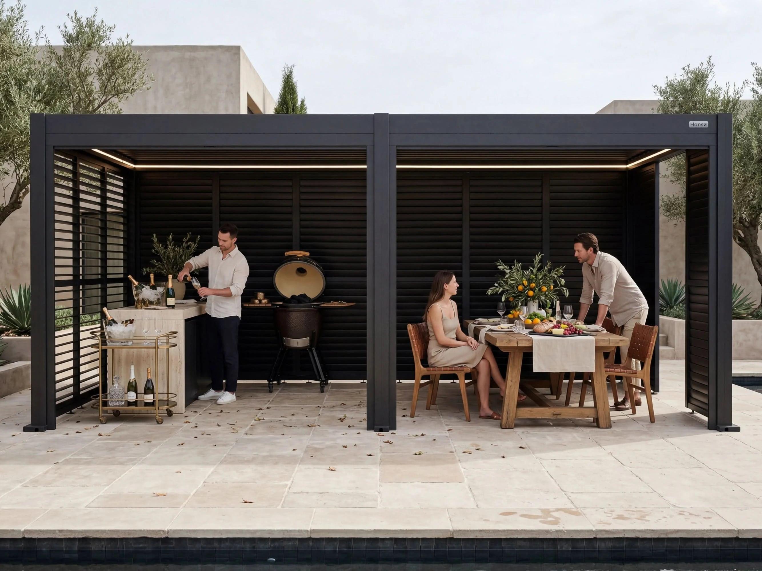 Hansø Horizon pergola in dark gray over an outdoor dining table with people seated beneath the closed louvers