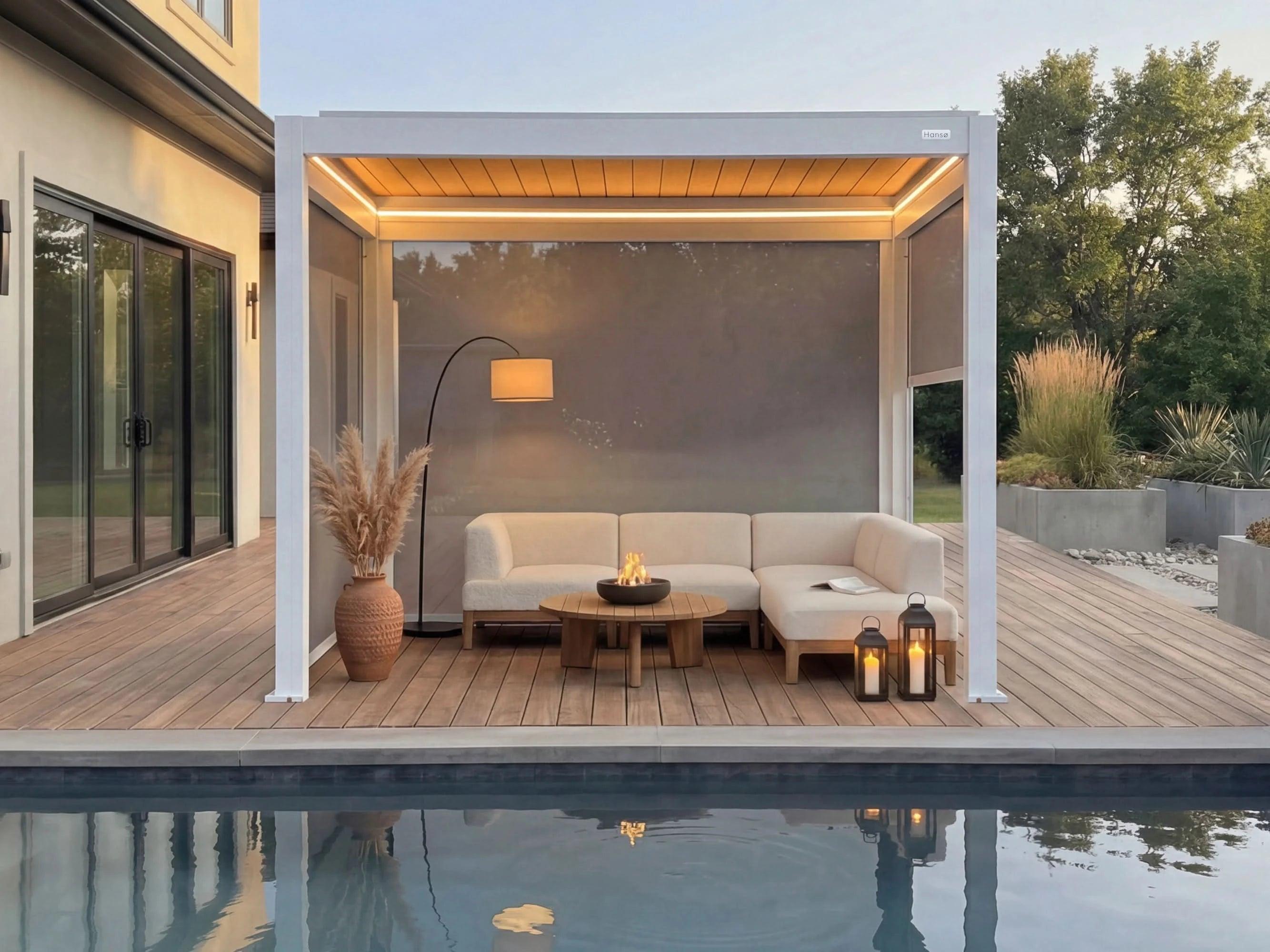 Hansø Horizon pergola at dusk with its integrated LED lighting on and lounge seating underneath