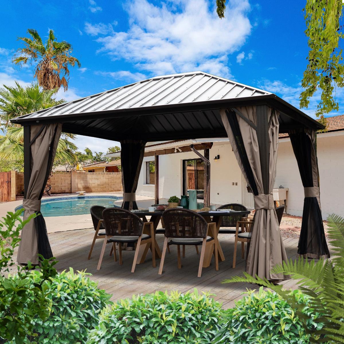 Kozyard Rosana 10x12 hardtop gazebo with a gray roof and dark curtains over a dining table beside a pool