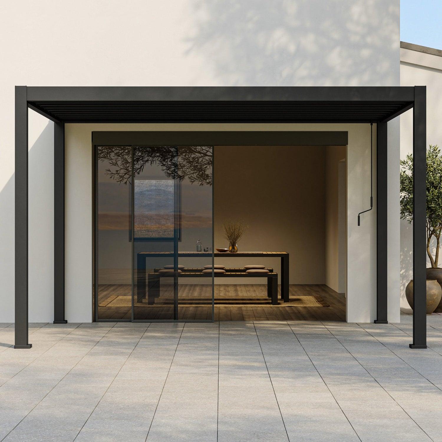 Mirador 111A Origami pergola in charcoal shading a terrace in front of a rendered house