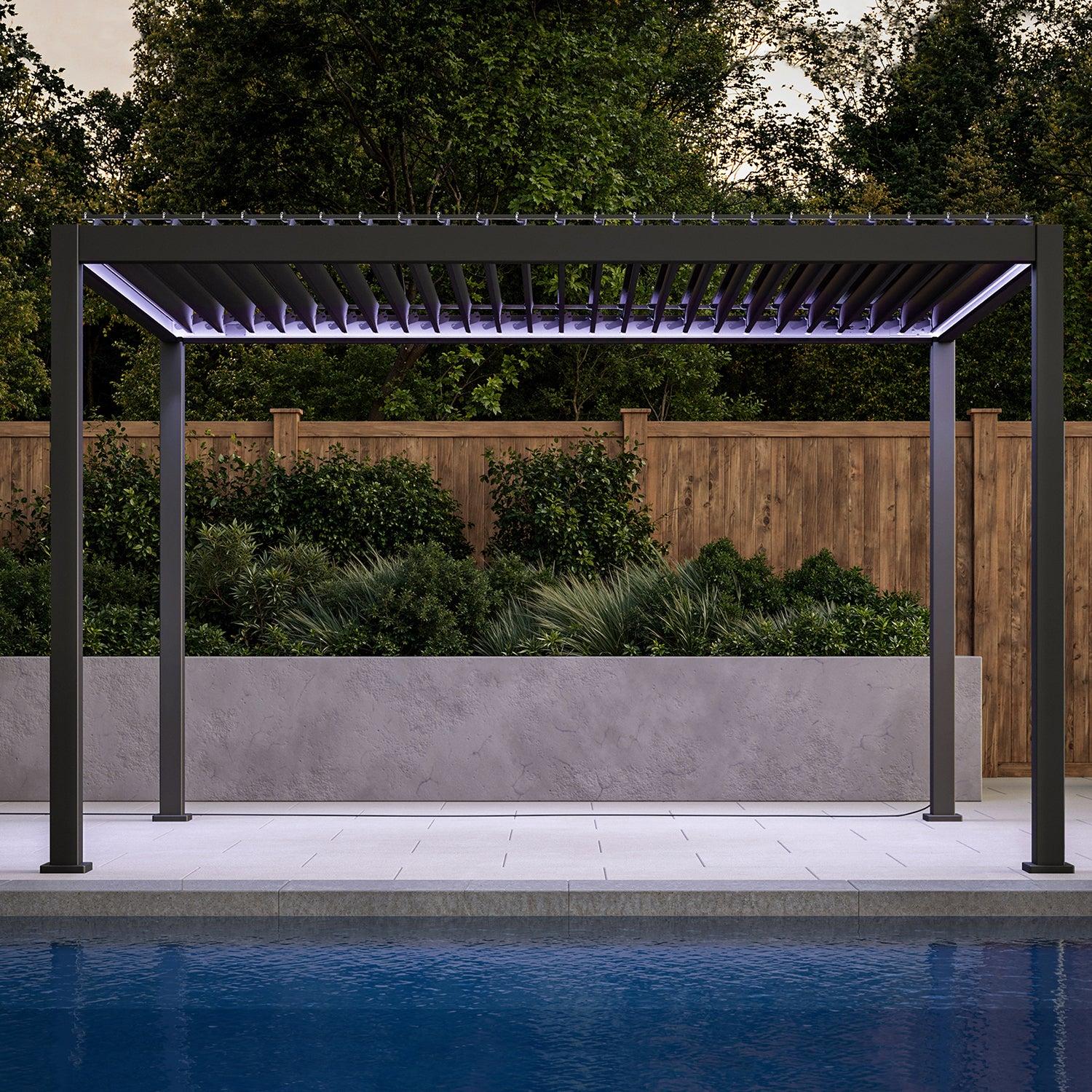 Mirador 111S e-Motion pergola in charcoal lit in violet over a poolside terrace in the evening