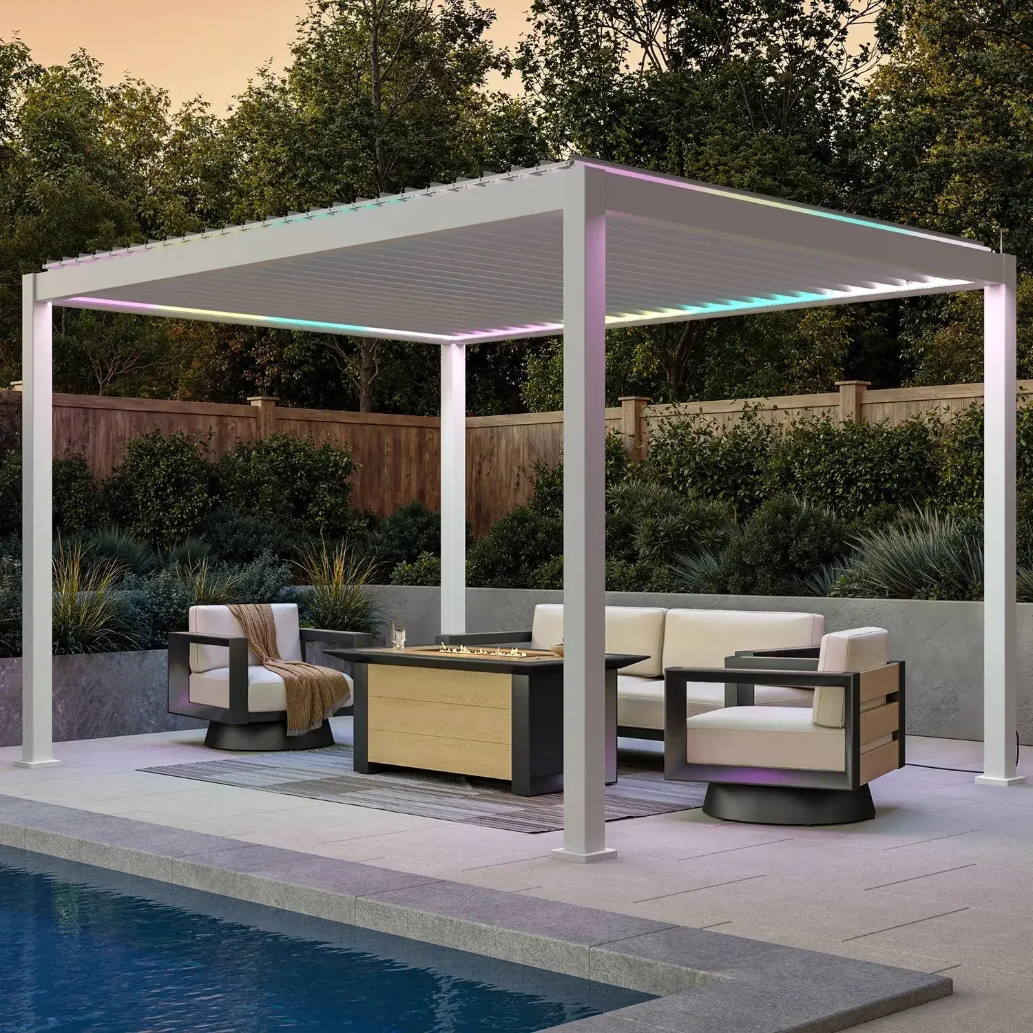 Mirador 111S e-Motion motorised pergola in white with colour-changing LED lighting over poolside seating