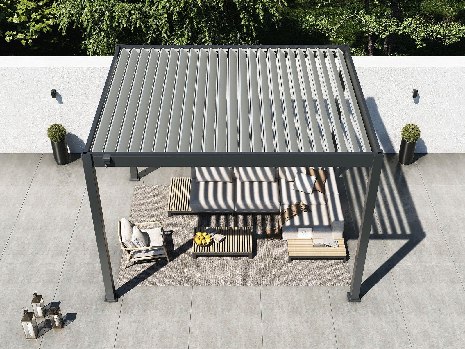 Overhead view of the 10' x 12' Lugano louvered pergola shading a sofa set on a walled terrace, louvers open