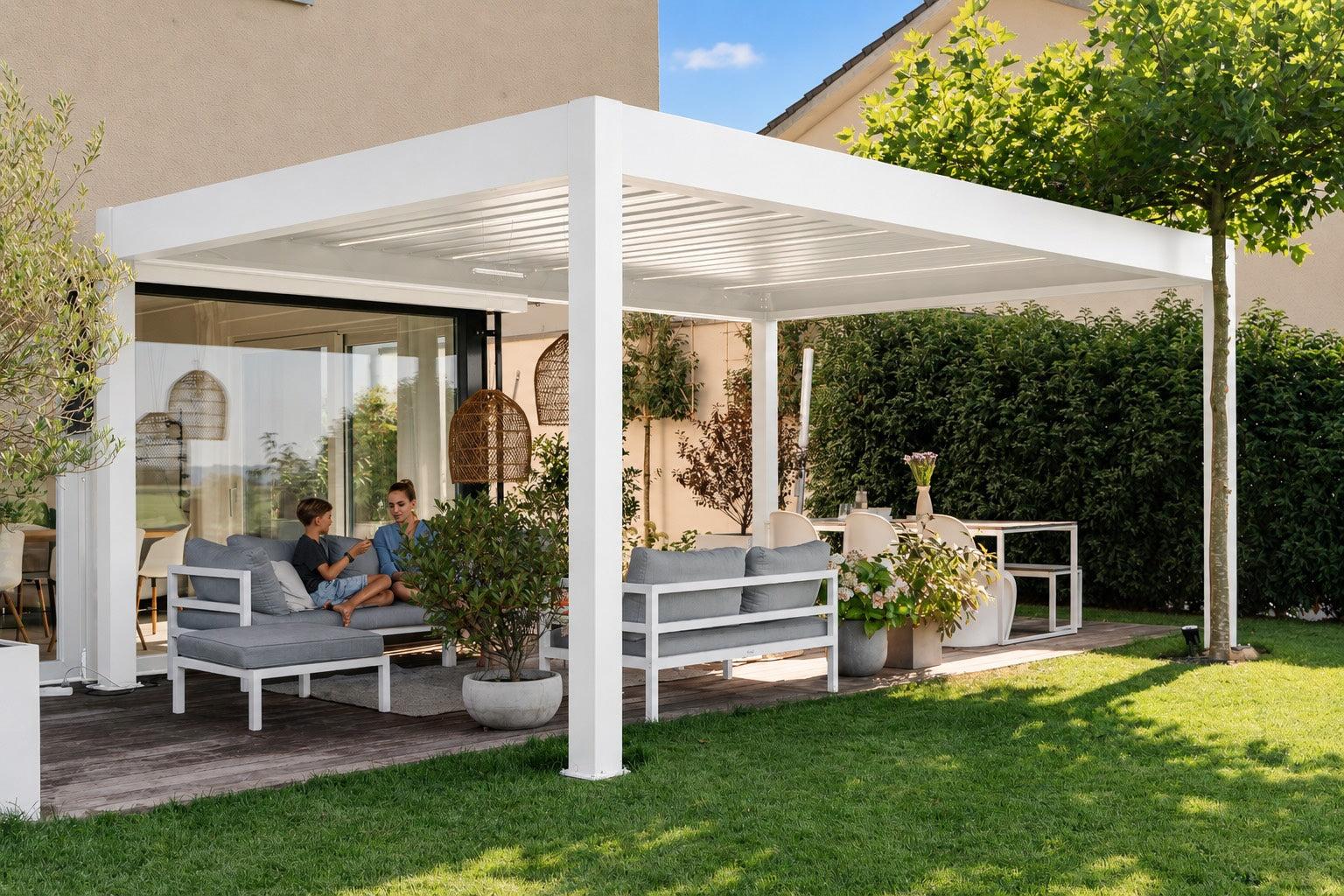 PERGOLUX Pergola 4 Pro Max motorized louvered pergola in white over a garden terrace lounge with a family seated beneath
