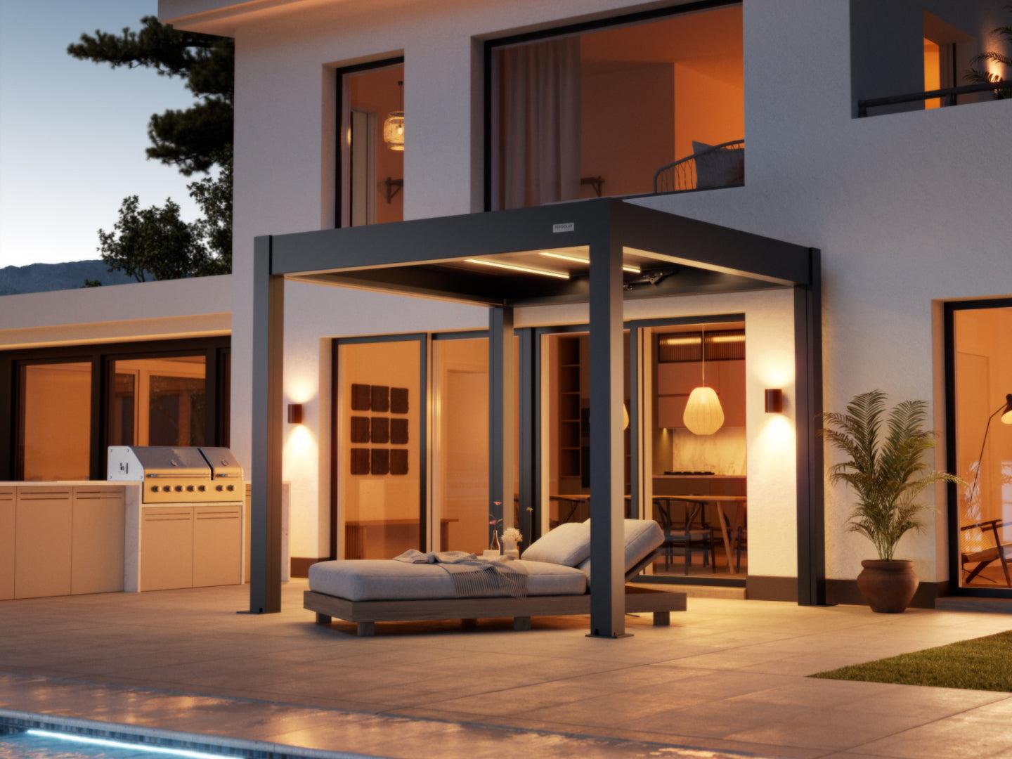 PERGOLUX Skydance S3 motorized louvered pergola in anthracite with louver-integrated lighting, over a poolside lounge at dusk