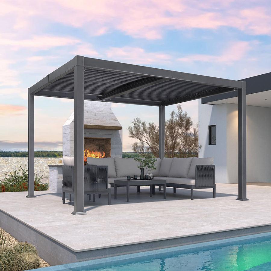 PURPLE LEAF Caesar louvered pergola in grey aluminium over a poolside patio lounge set with an outdoor fireplace