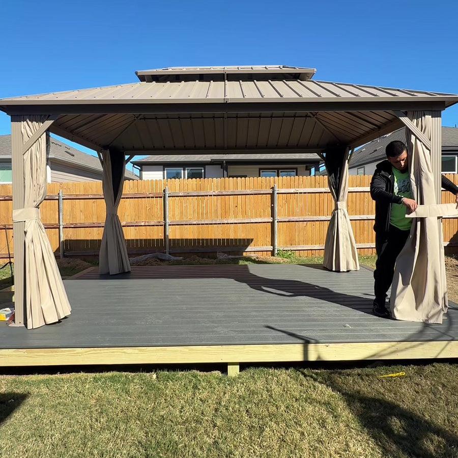 Champagne hardtop gazebo on a wooden deck with the curtains pulled open