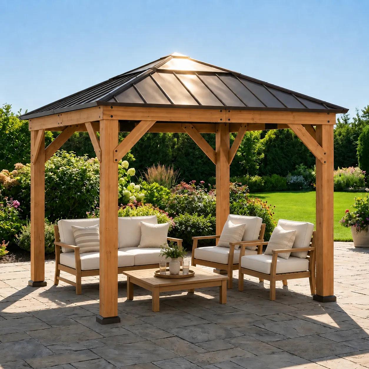 Sunjoy Antrim Skylight Cedar gazebo 9x9 on a stone patio with a sofa and armchairs beneath it, daylight showing through the skylight at the roof ridge
