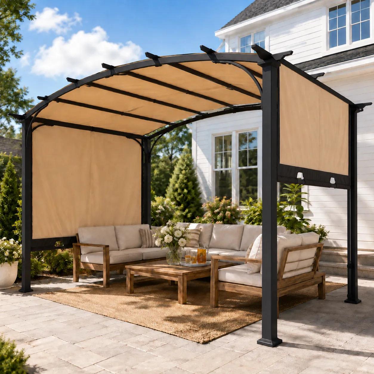 Sunjoy Arcadia Adjustable Arched pergola on a paved patio beside a white house, shading a cream outdoor sofa set