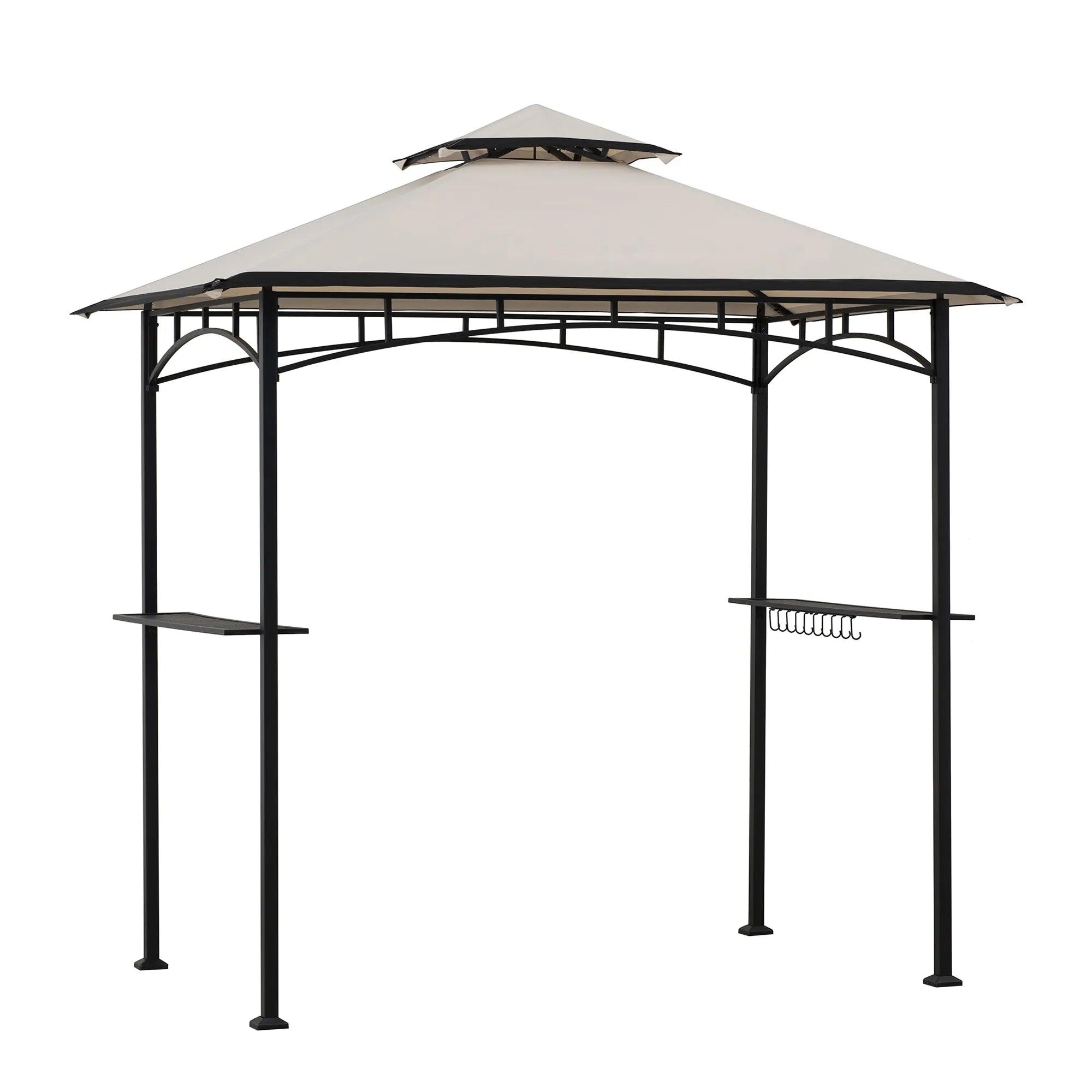 Sunjoy BBQ 2-Tier Grill Canopy 5x8 in beige, studio view of the two-tier fabric canopy on a black steel frame with a side shelf and utensil hooks