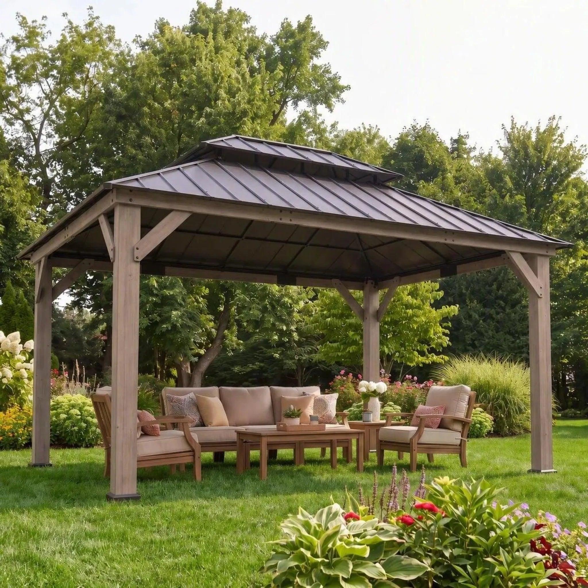 Sunjoy Cedar Frame 12x16 gazebo on a lawn beside a flowerbed, sheltering a cushioned sofa set