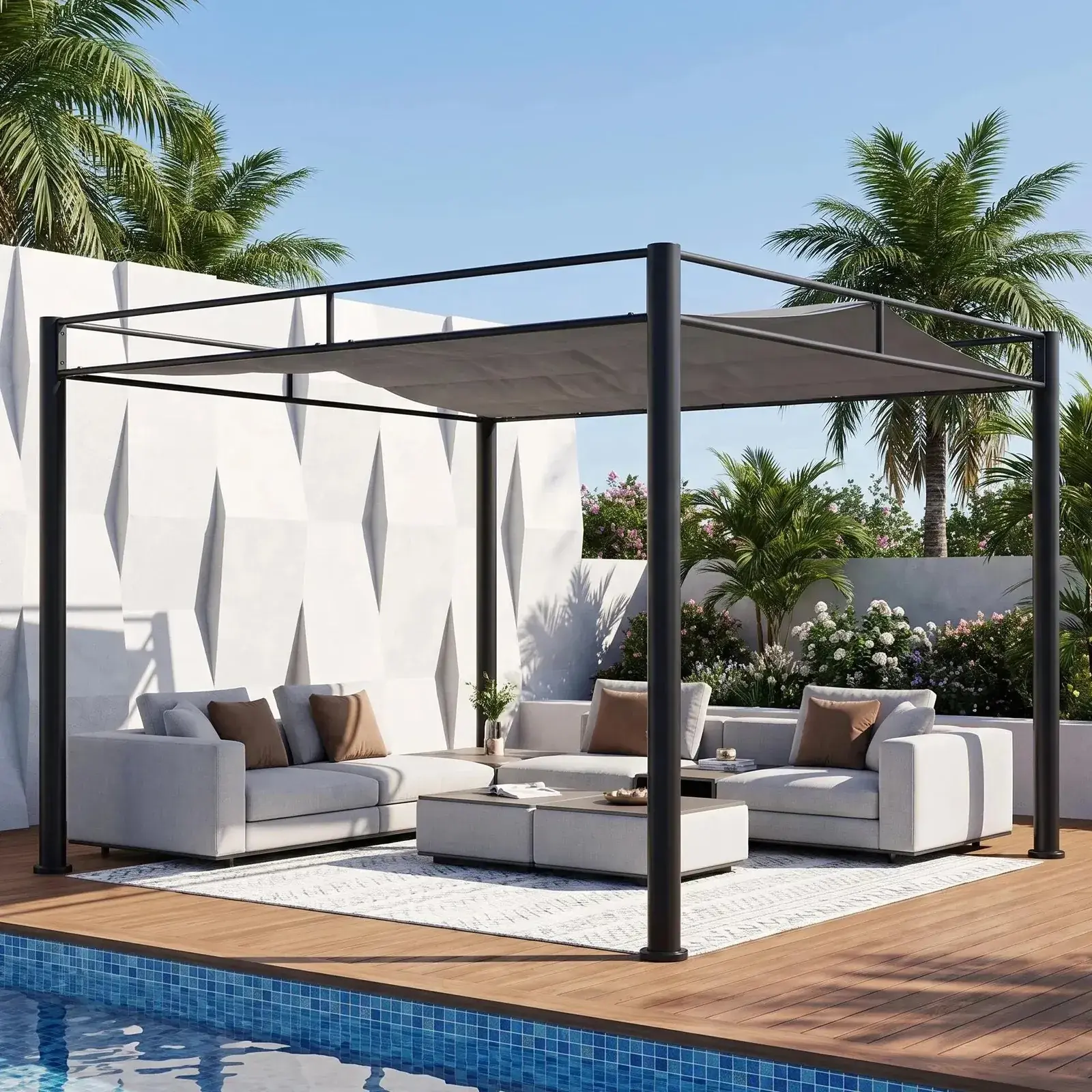 Sunjoy Darkeford pergola in Shadow Black on a poolside deck, shading a pale grey outdoor sectional