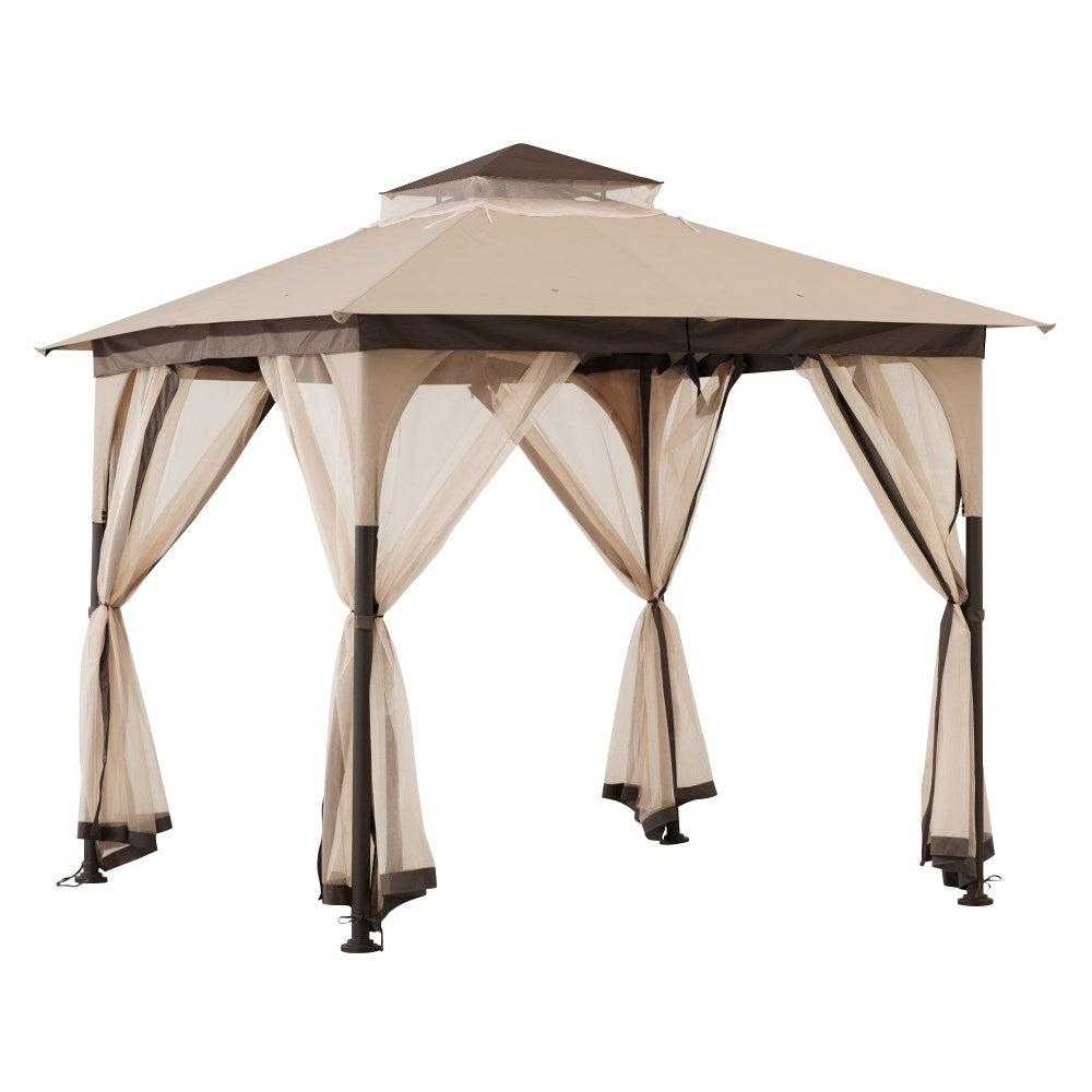 Sunjoy 9x9 garden soft top gazebo in beige, studio view of the two-tier vented canopy on a brown steel frame with netting at each side
