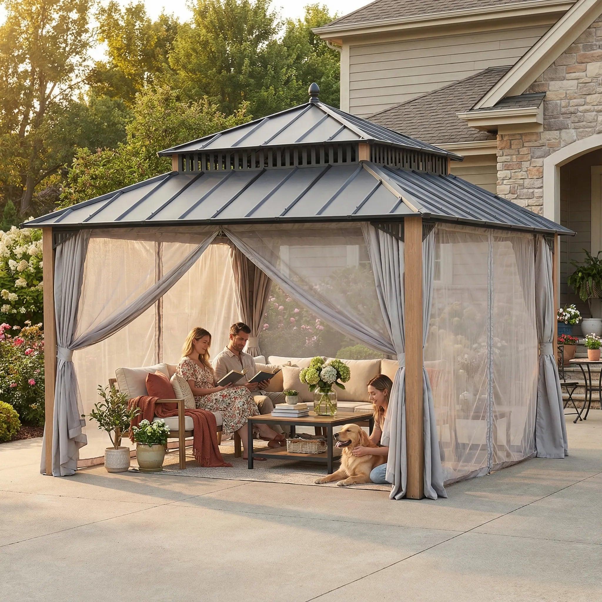 Sunjoy Kingston Aluminum gazebo 12x12 in Natural Woodgrain on a patio, its woodgrain-finish aluminium posts and grey curtains framing a sofa and coffee table