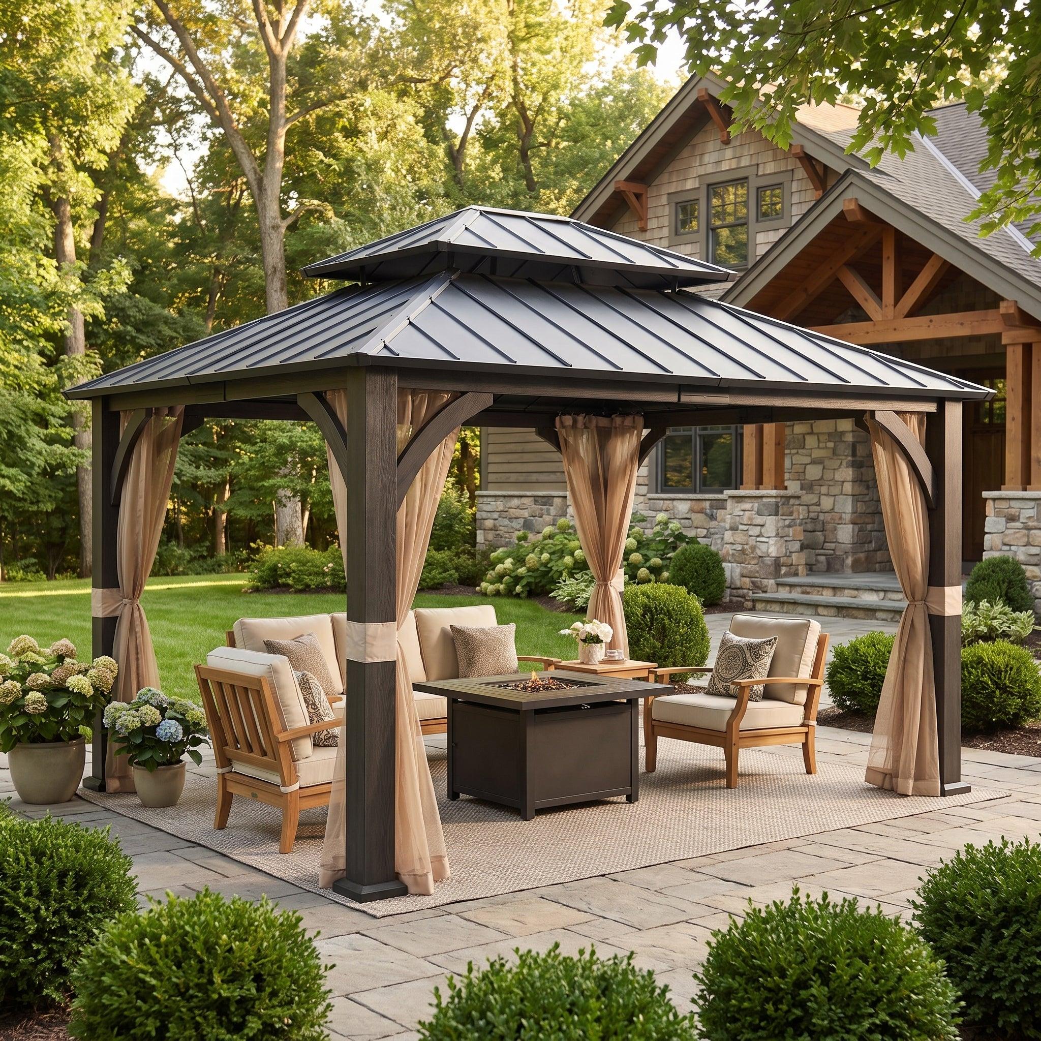 Sunjoy Meridian 13x15 woodgrain metal gazebo on a paved patio beside a timber house, sheltering armchairs around a gas fire table