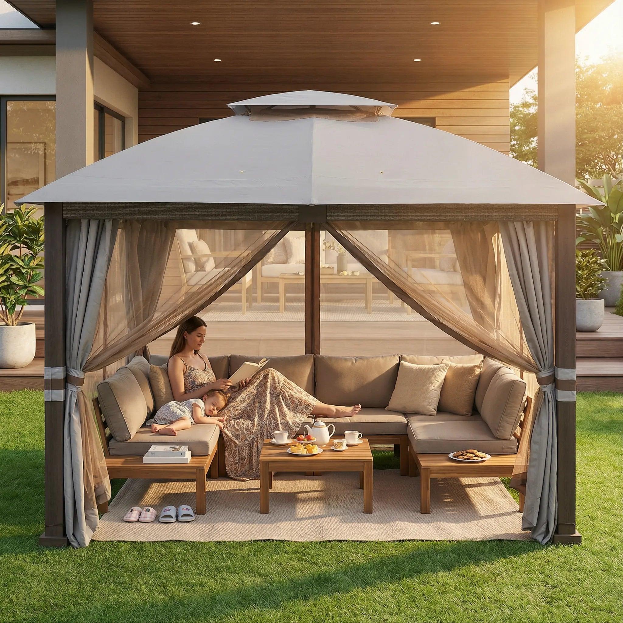Sunjoy double-tier premium soft-top gazebo 11x13 on a lawn, a woman reading on a corner sofa beneath the canopy with curtains drawn at one side