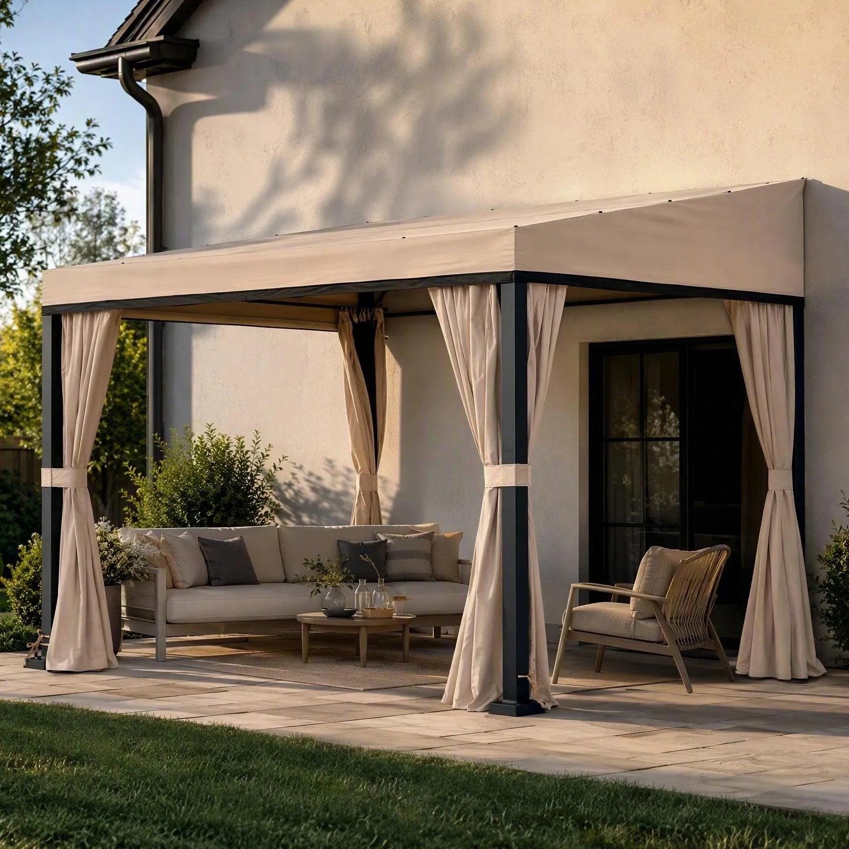 Sunjoy Vista fabric-roof wall-mounted gazebo 10x12 against a house wall, sheltering an outdoor sofa and armchair on a lawn