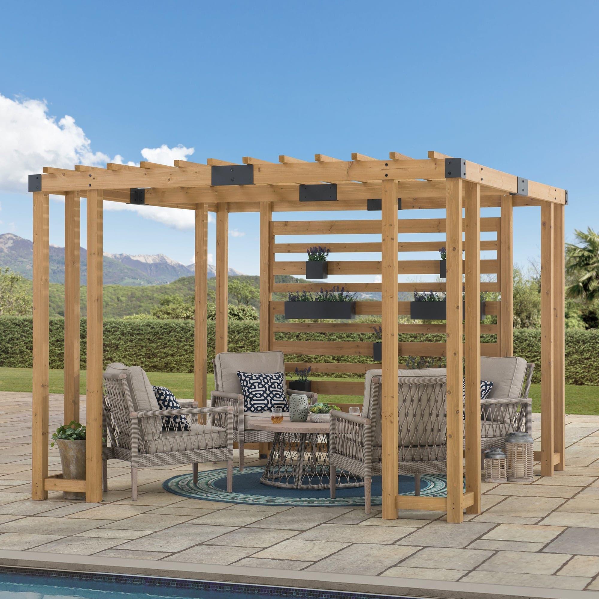 Sunjoy 10x10 cedar privacy pergola beside a pool, planters filled with lavender on the slatted screen above a wicker seating group