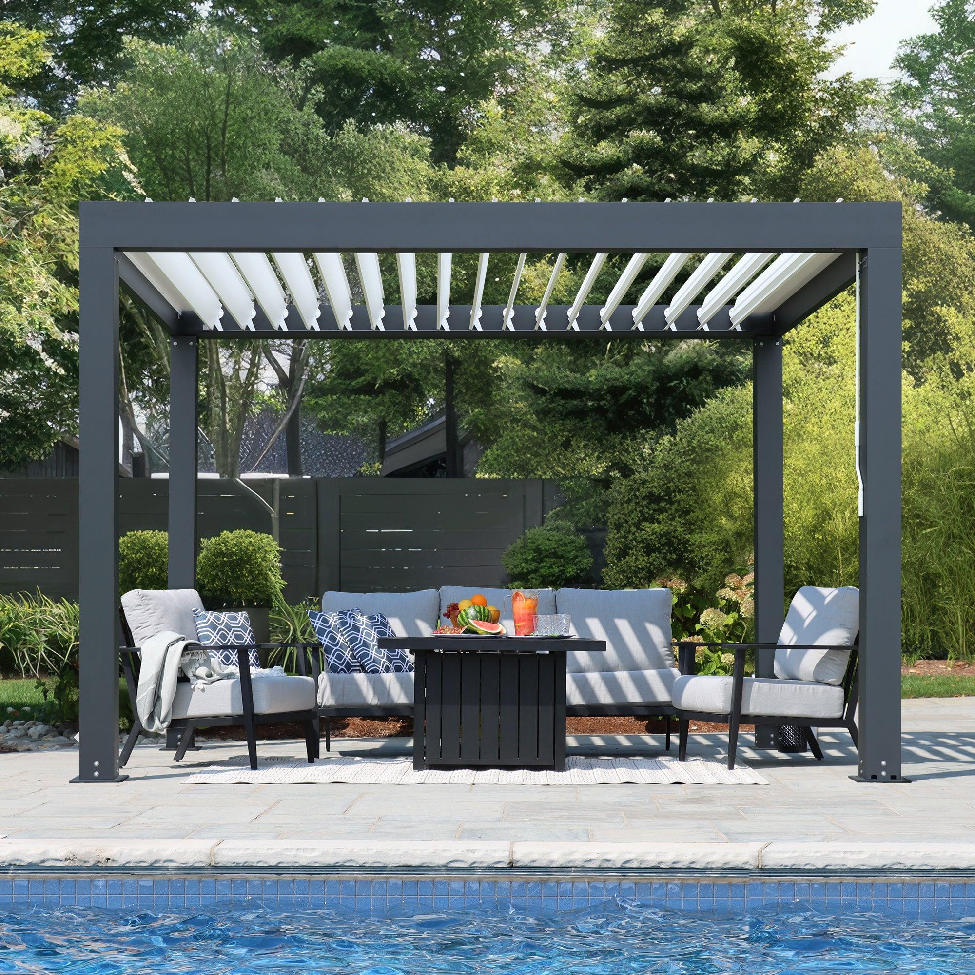 Yardistry Aluminum Louver Room in graphite grey powder-coated aluminium beside a swimming pool, white louvers open over a patio lounge set