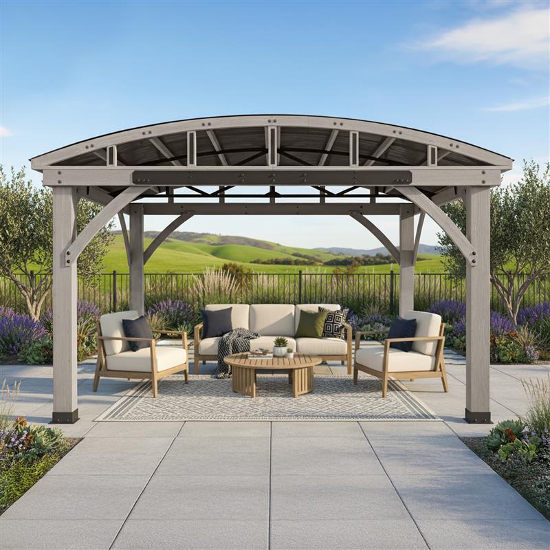 Arched Roof Gazebo on a paver patio with a sofa and armchairs under the arch