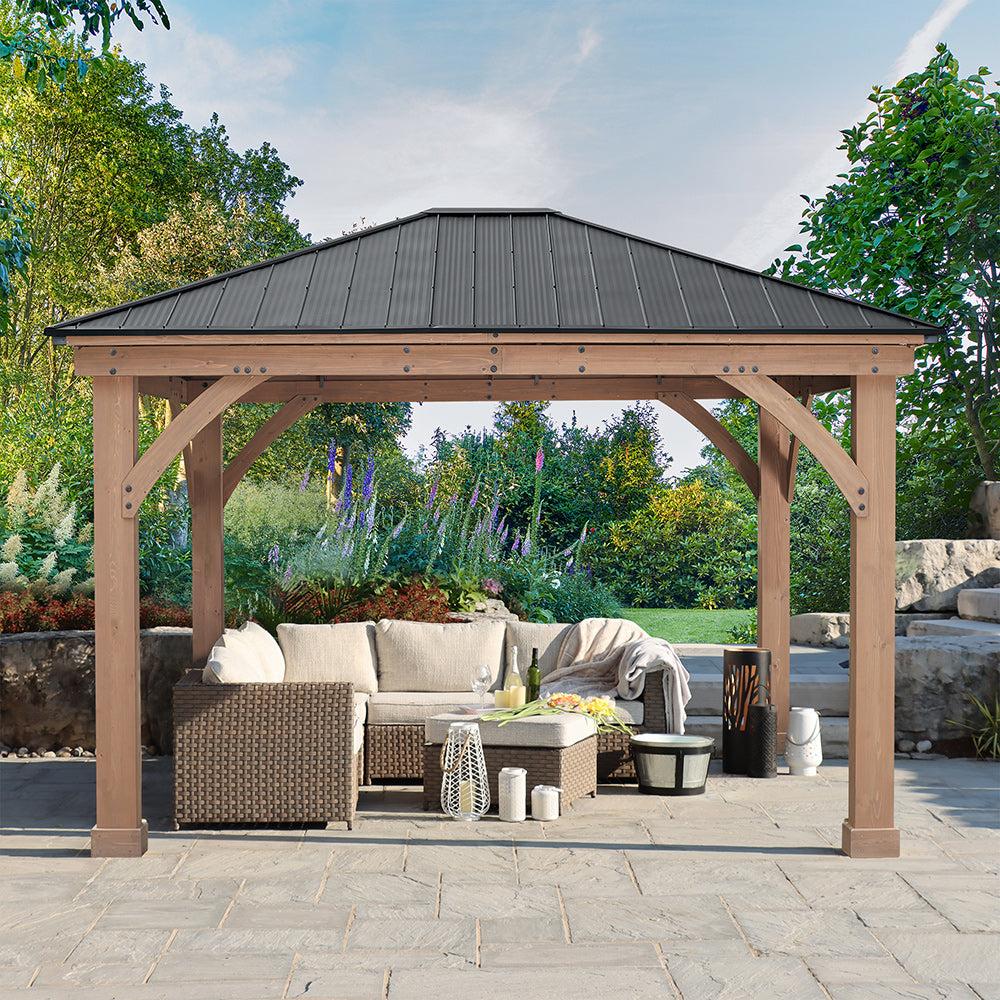 Everyday Gazebo seen from the front with a sofa and coffee table under the cedar frame