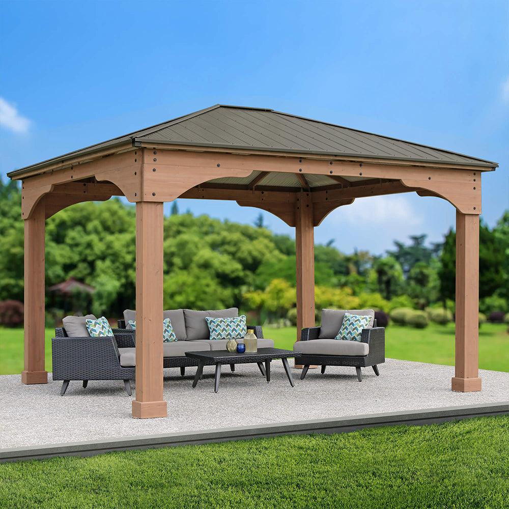 Grand Gazebo on a paver patio with a grey outdoor sofa set and lawn behind