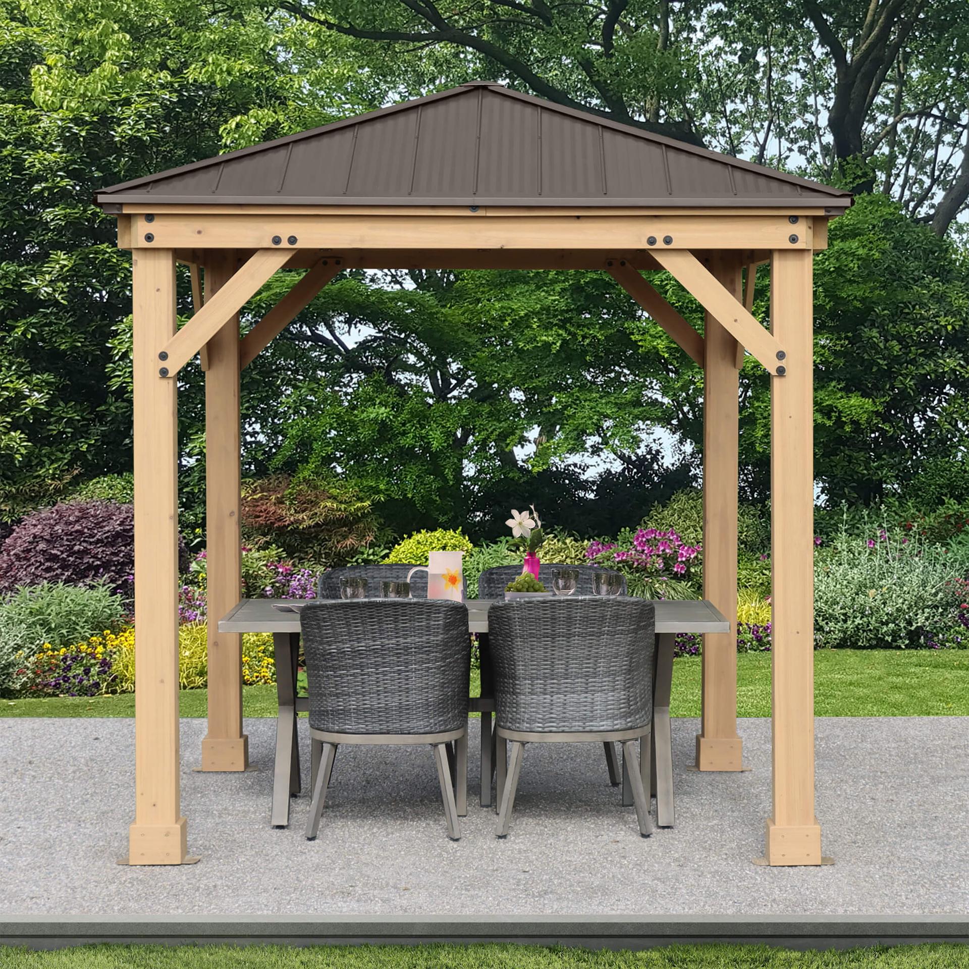 Front view of the Meridian cedar gazebo on a paver patio with a six-chair dining table underneath
