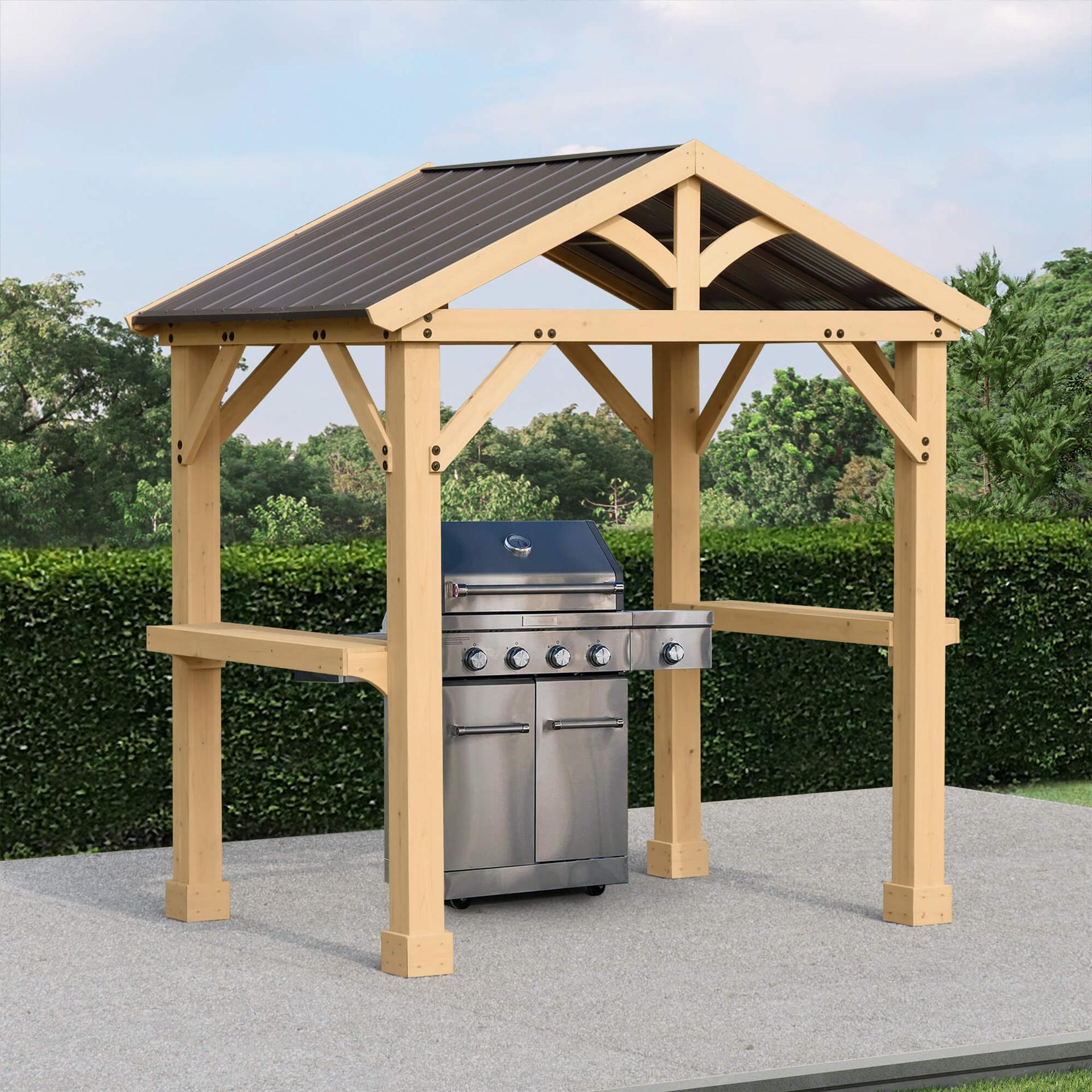 Yardistry Meridian Grilling Pavilion with a cedar gable frame and side counters sheltering a gas grill