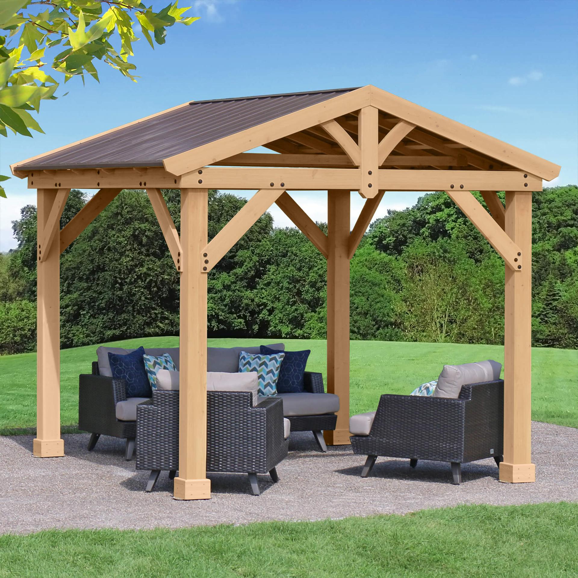 Yardistry 10x10 Meridian pavilion with an open cedar gable frame and aluminum roof over a patio lounge set