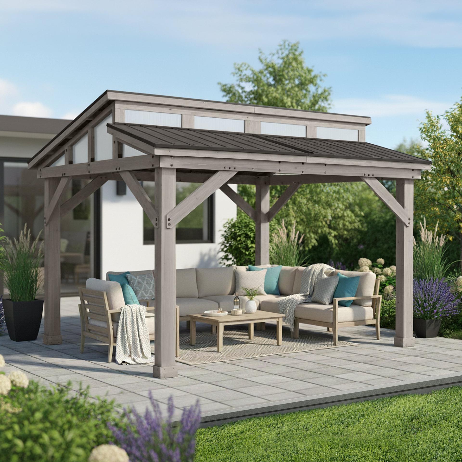 Yardistry 12x14 Split Roof Gazebo with a raised clerestory of polycarbonate roof windows over a sectional sofa