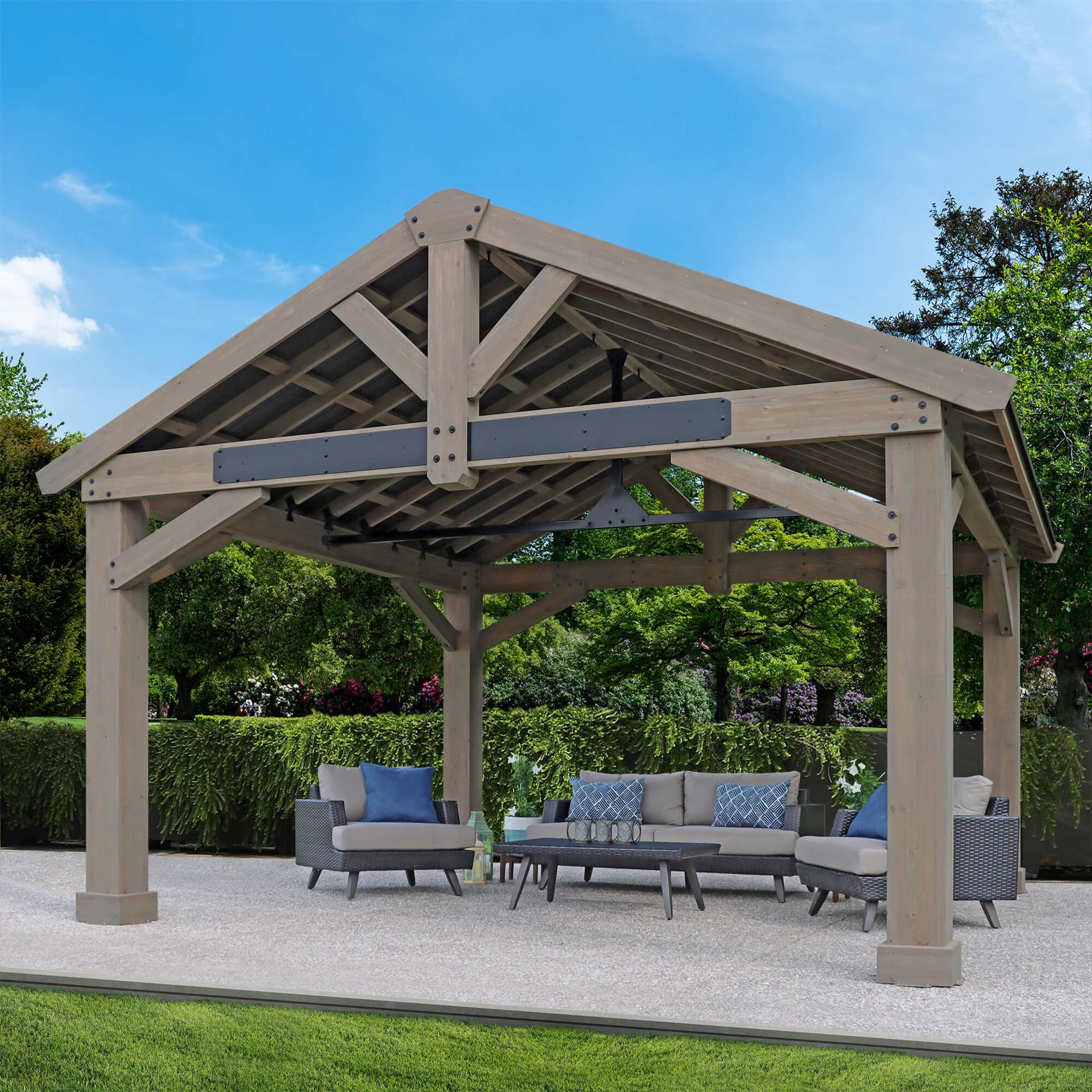 Yardistry 16x14 Timber Frame Pavilion with a gable aluminum roof and steel truss over a patio lounge set